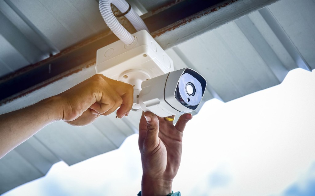 Technician adjusting a CCTV camera during installation