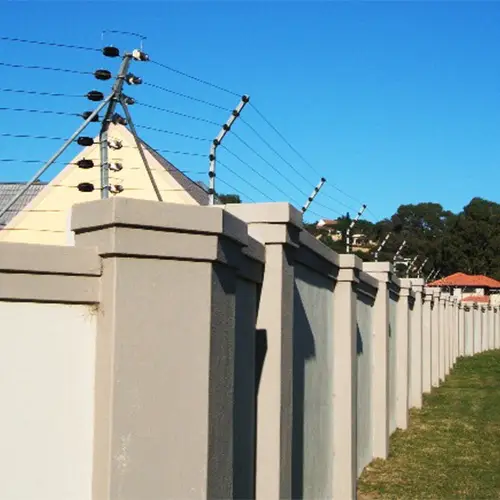 Completed electric fencing installed along a perimeter wall